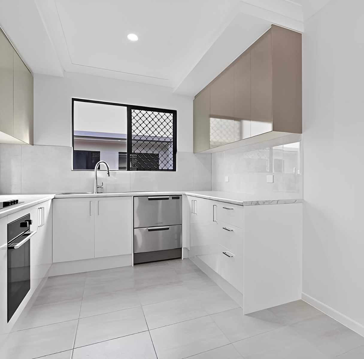 Sleek minimalist kitchen design with natural light.