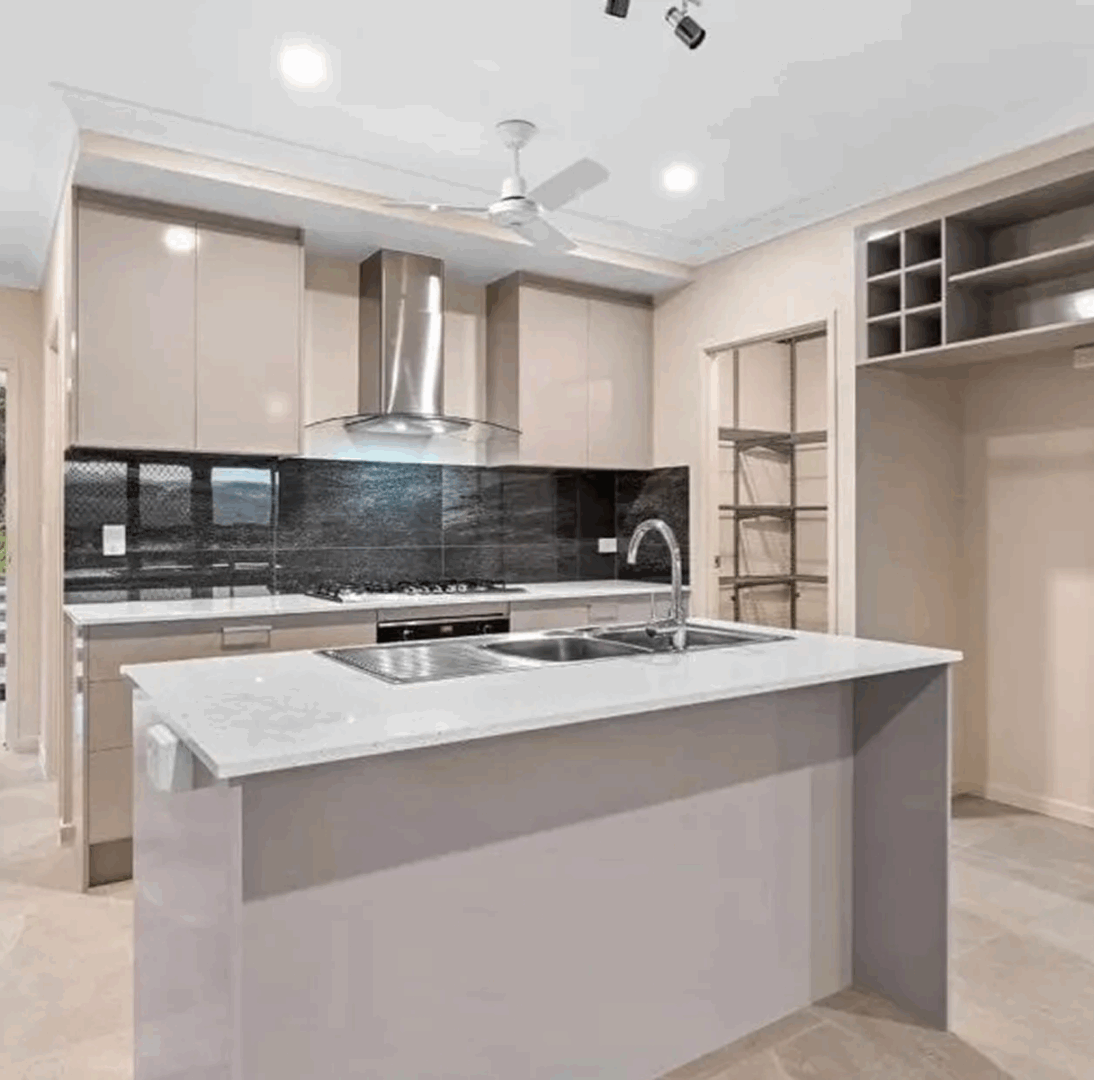 Stylish kitchen design with black backsplash
